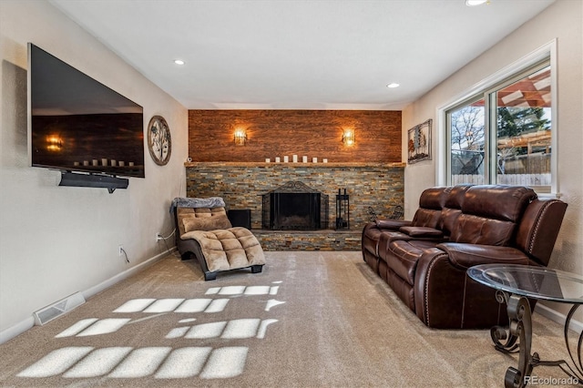 living room with light carpet and a fireplace