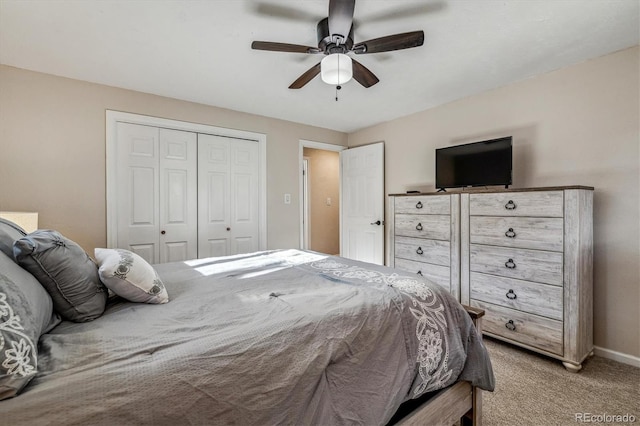 bedroom with a closet, ceiling fan, and carpet