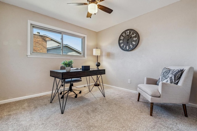 carpeted office space featuring ceiling fan