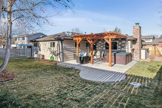 back of house featuring a pergola, a yard, central air condition unit, a hot tub, and a patio area