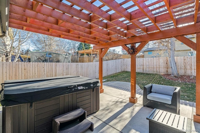 view of patio / terrace with a hot tub and a pergola