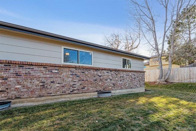 view of property exterior with a lawn