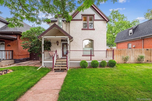 912 S Washington St, Denver, CO 80209 - victorian home featuring stucco siding and covered porch