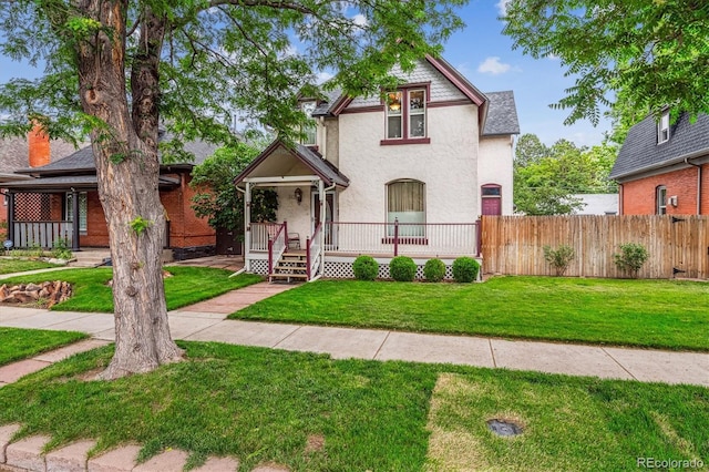 912 S Washington St, Denver, CO 80209 - view of front of property with stucco siding and a porch