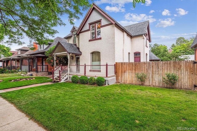 912 S Washington St, Denver, CO 80209 - victorian house with stucco siding and roof with shingles