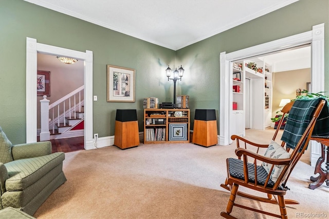 912 S Washington St, Denver, CO 80209 - sitting room featuring carpet floors, stairway, ornamental molding, and a chandelier