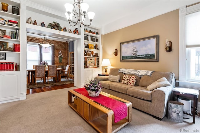 912 S Washington St, Denver, CO 80209 - carpeted living room with a chandelier and ornamental molding