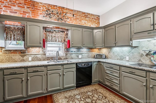 912 S Washington St, Denver, CO 80209 - kitchen featuring black appliances, under cabinet range hood, gray cabinetry, and decorative backsplash