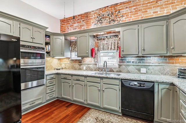 912 S Washington St, Denver, CO 80209 - kitchen featuring black appliances, decorative backsplash, light stone countertops, dark wood-type flooring, and open shelves
