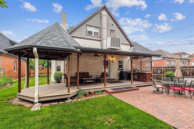 912 S Washington St, Denver, CO 80209 - back of property featuring a fenced backyard, a gazebo, a wooden deck, a covered hot tub, and ceiling fan