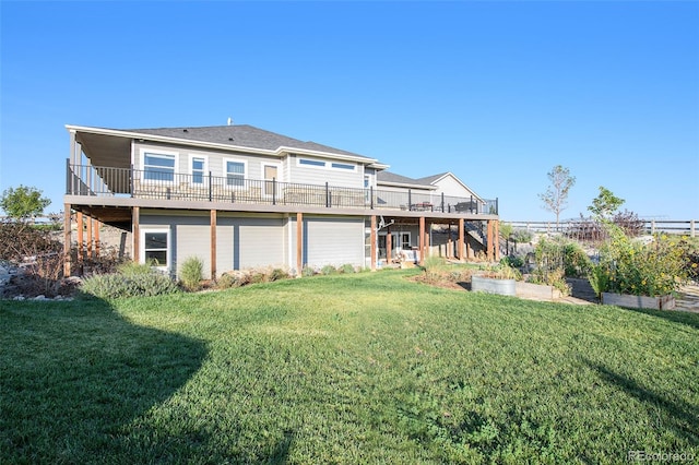 back of house featuring a lawn and a deck