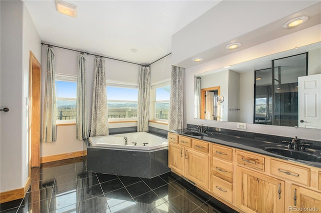 bathroom featuring tile patterned floors, independent shower and bath, and vanity