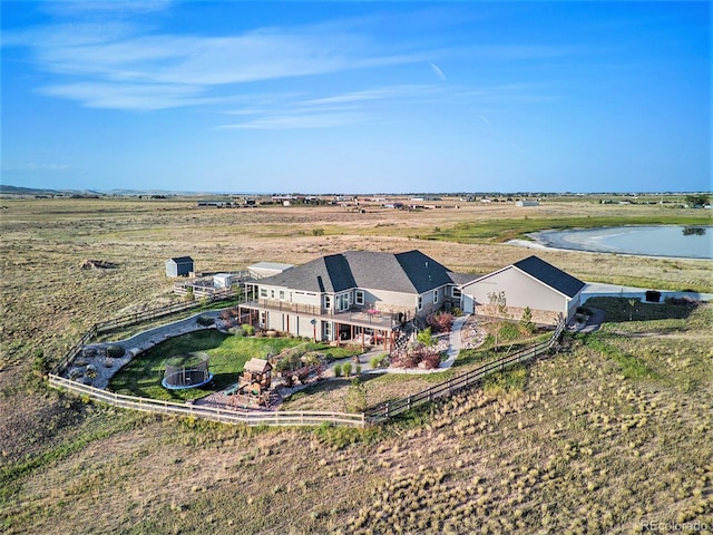 aerial view with a water view and a rural view