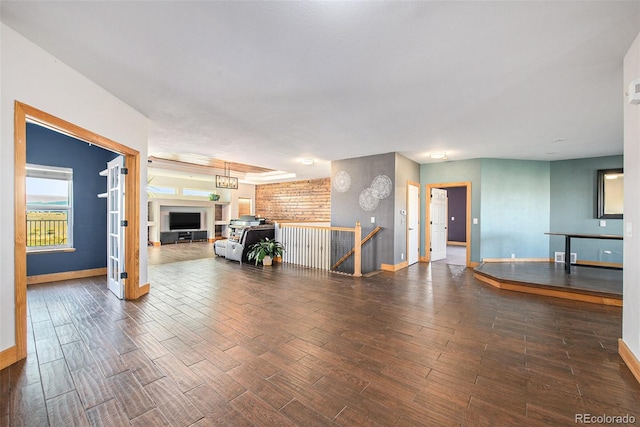 unfurnished living room featuring dark hardwood / wood-style flooring