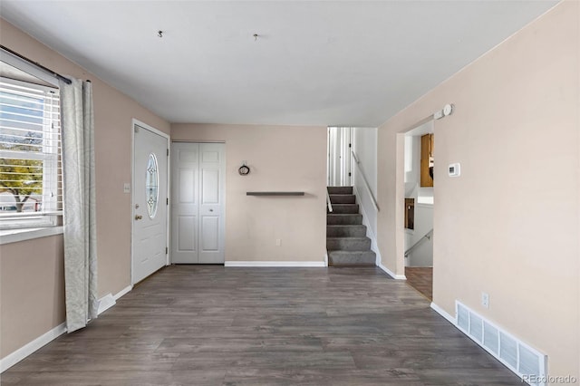 foyer entrance with dark hardwood / wood-style flooring