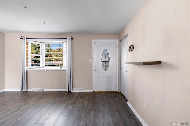 foyer with dark hardwood / wood-style floors