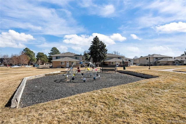 exterior space featuring a residential view and a lawn