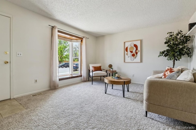 8625 W Dartmouth Pl, Lakewood, CO 80227 - living room featuring carpet, a textured ceiling, and baseboards