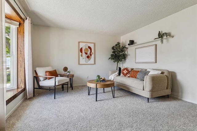 8625 W Dartmouth Pl, Lakewood, CO 80227 - living room featuring plenty of natural light, carpet flooring, a textured ceiling, and baseboards
