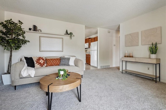 8625 W Dartmouth Pl, Lakewood, CO 80227 - living room with light carpet and a textured ceiling