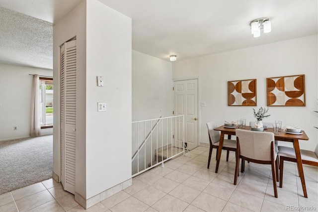 8625 W Dartmouth Pl, Lakewood, CO 80227 - dining space featuring light tile patterned flooring and light colored carpet