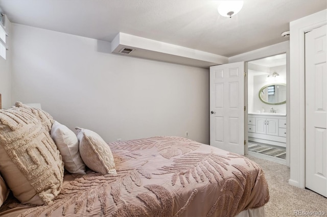 8625 W Dartmouth Pl, Lakewood, CO 80227 - bedroom with carpet floors, a sink, and ensuite bath