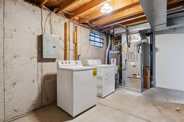 8625 W Dartmouth Pl, Lakewood, CO 80227 - laundry room with electric panel, gas water heater, washer and dryer, and heating unit