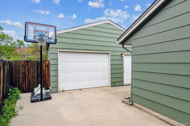 8625 W Dartmouth Pl, Lakewood, CO 80227 - garage with concrete driveway and fence
