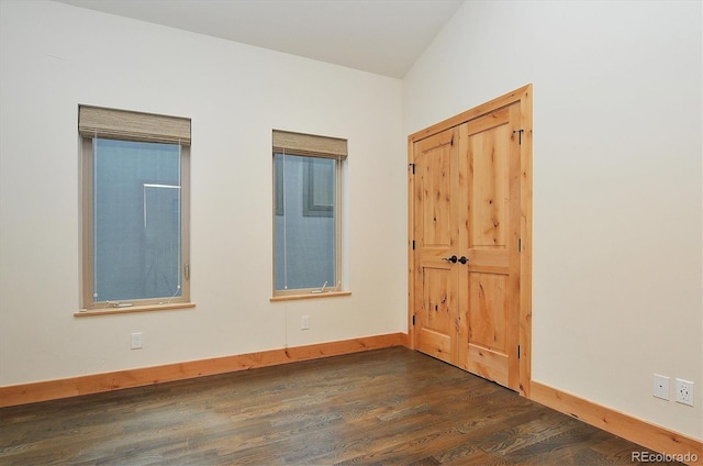656 S Gunnison Ave, Buena Vista, CO 81211 - unfurnished room with dark wood-style flooring and baseboards