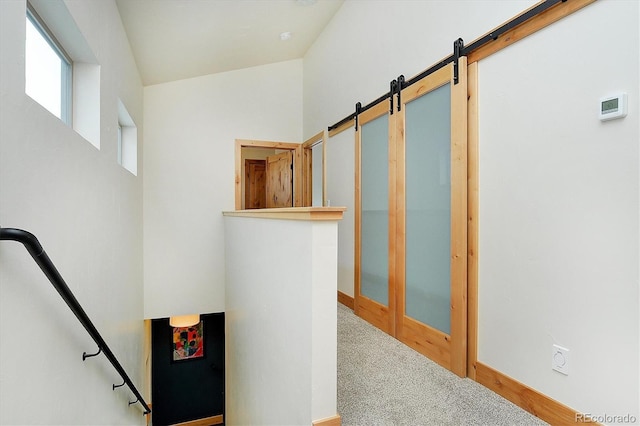 656 S Gunnison Ave, Buena Vista, CO 81211 - staircase featuring a barn door, carpet floors, and baseboards
