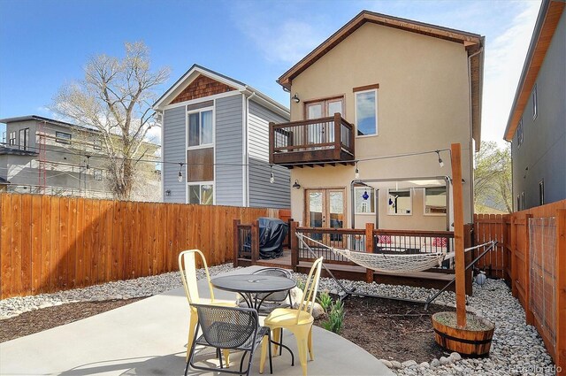656 S Gunnison Ave, Buena Vista, CO 81211 - rear view of property with french doors, a deck, a fenced backyard, a balcony, and a patio area