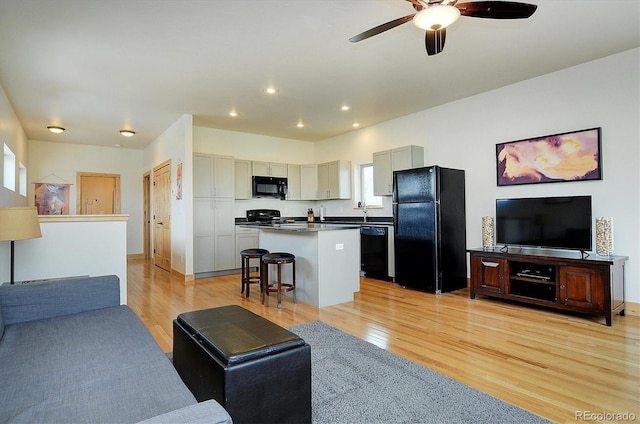 656 S Gunnison Ave, Buena Vista, CO 81211 - living room featuring recessed lighting, light wood finished floors, and ceiling fan
