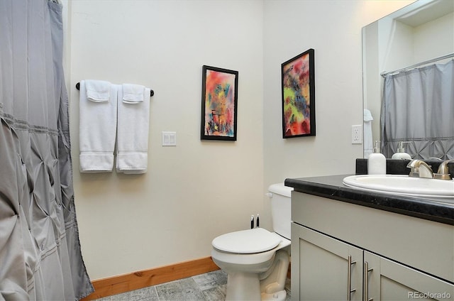 656 S Gunnison Ave, Buena Vista, CO 81211 - full bathroom with vanity, toilet, a shower with curtain, and wood finished floors