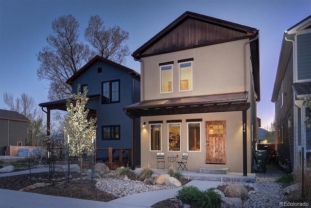 656 S Gunnison Ave, Buena Vista, CO 81211 - view of front of property with a porch and stucco siding