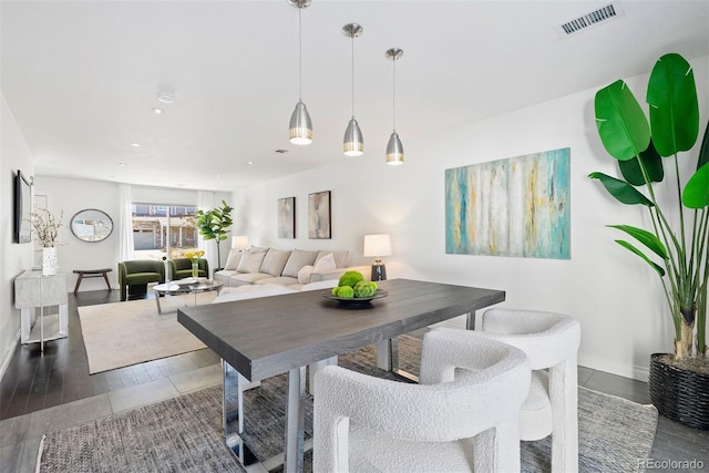 dining space with dark wood-type flooring