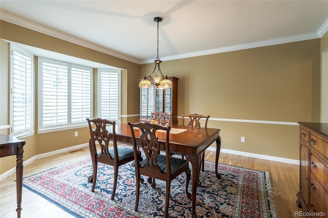 14261 W Evans Cir, Lakewood, CO 80228 - dining space with light wood-type flooring and crown molding