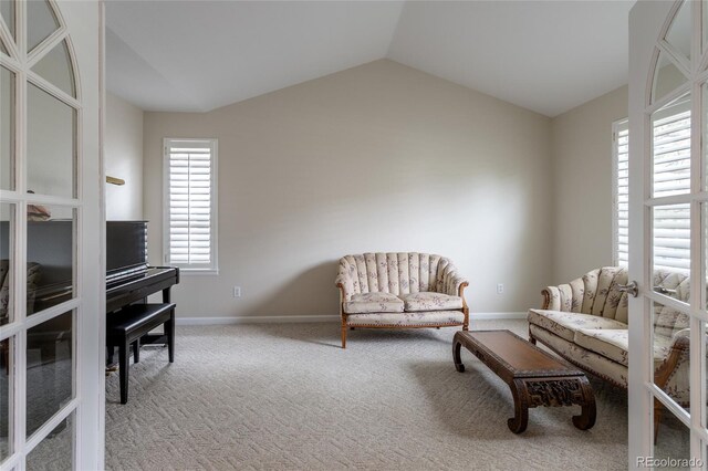 14261 W Evans Cir, Lakewood, CO 80228 - living area featuring vaulted ceiling and carpet
