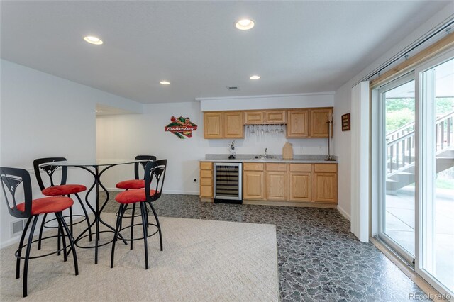 14261 W Evans Cir, Lakewood, CO 80228 - kitchen with beverage cooler, light brown cabinetry, recessed lighting, and light countertops