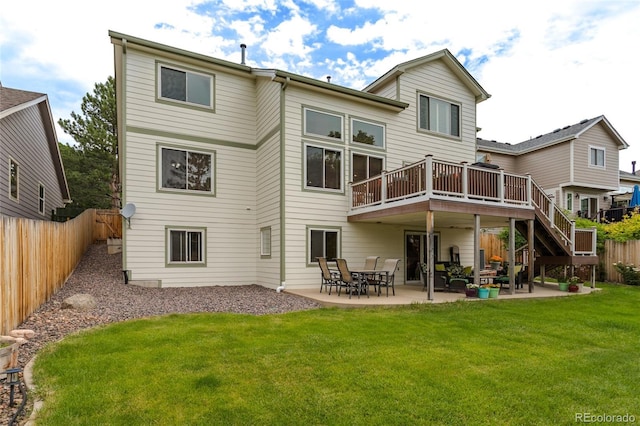 14261 W Evans Cir, Lakewood, CO 80228 - rear view of property featuring a fenced backyard, a wooden deck, a patio area, and stairway