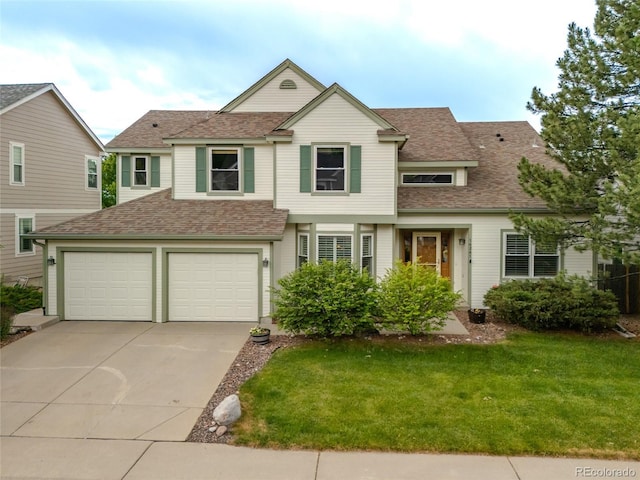 14261 W Evans Cir, Lakewood, CO 80228 - traditional-style home featuring concrete driveway, a front lawn, roof with shingles, and a garage