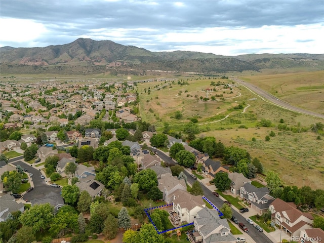 14261 W Evans Cir, Lakewood, CO 80228 - aerial view of residential area with property parcel outlined and a mountainous background