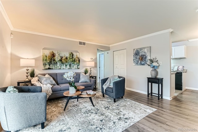 10211 Ura Ln Unit 1-308, Thornton, CO 80260 - living area with crown molding and wood finished floors