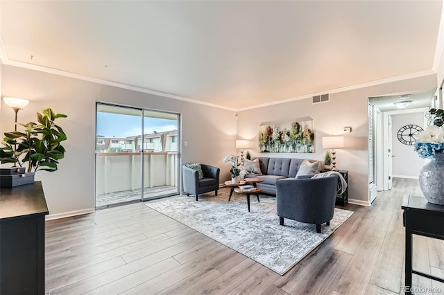 10211 Ura Ln Unit 1-308, Thornton, CO 80260 - living room featuring wood finished floors and crown molding