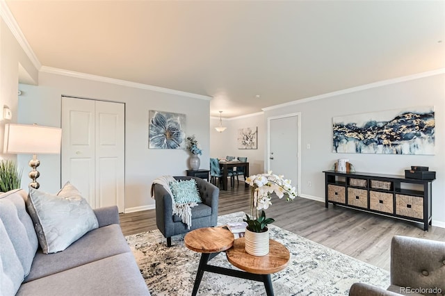10211 Ura Ln Unit 1-308, Thornton, CO 80260 - living area featuring wood finished floors and ornamental molding