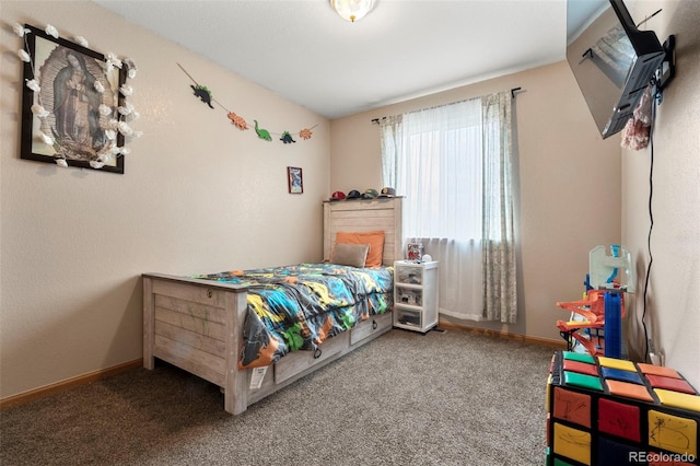 carpeted bedroom with baseboards