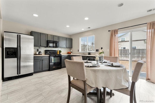 dining room featuring recessed lighting and visible vents