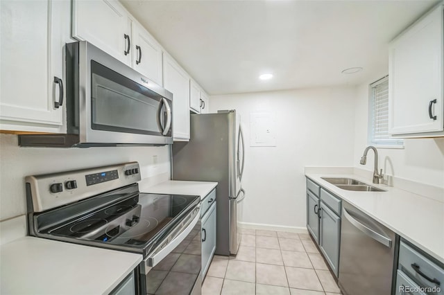 10303 E Peakview Ave Unit G203, Englewood, CO 80111 - kitchen featuring light countertops, stainless steel appliances, and a sink
