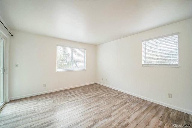 10303 E Peakview Ave Unit G203, Englewood, CO 80111 - spare room with baseboards and light wood-style flooring