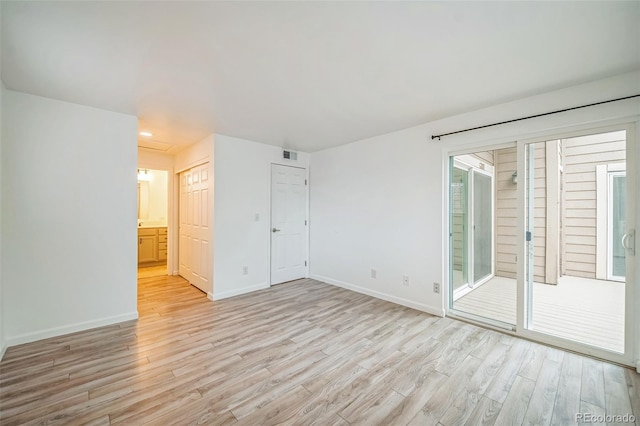10303 E Peakview Ave Unit G203, Englewood, CO 80111 - spare room featuring light wood-type flooring, visible vents, and baseboards
