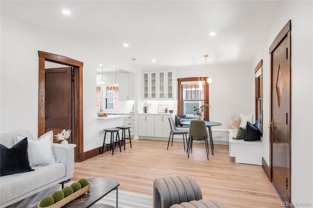 living area featuring recessed lighting and light wood-type flooring